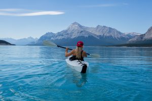 Woman doing kayaking in a beautiful lake 5K
