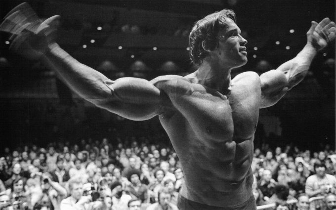 Arnold Schwarzenegger posing in the Mr.Olympia
