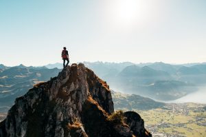 Hiker on top of a mountain 4K
