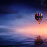 Hot Air Balloon Over The Ocean At Sunset