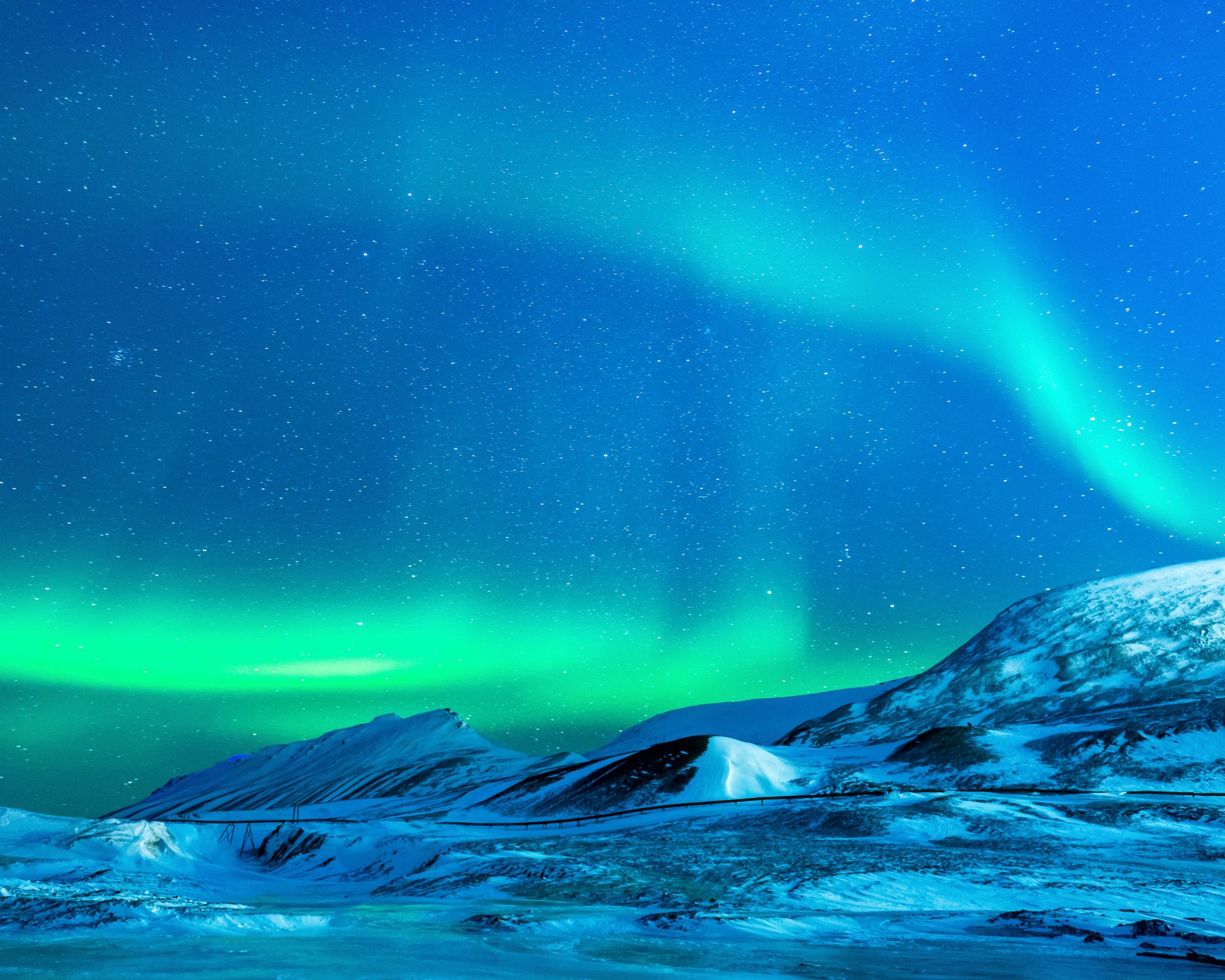 Aurora Borealis Over Snowy Mountains 4K UHD Wallpaper