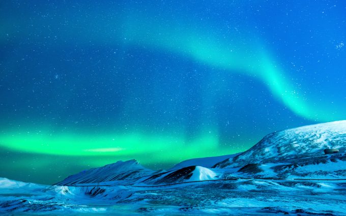 Aurora Borealis Over Snowy Mountains 4K